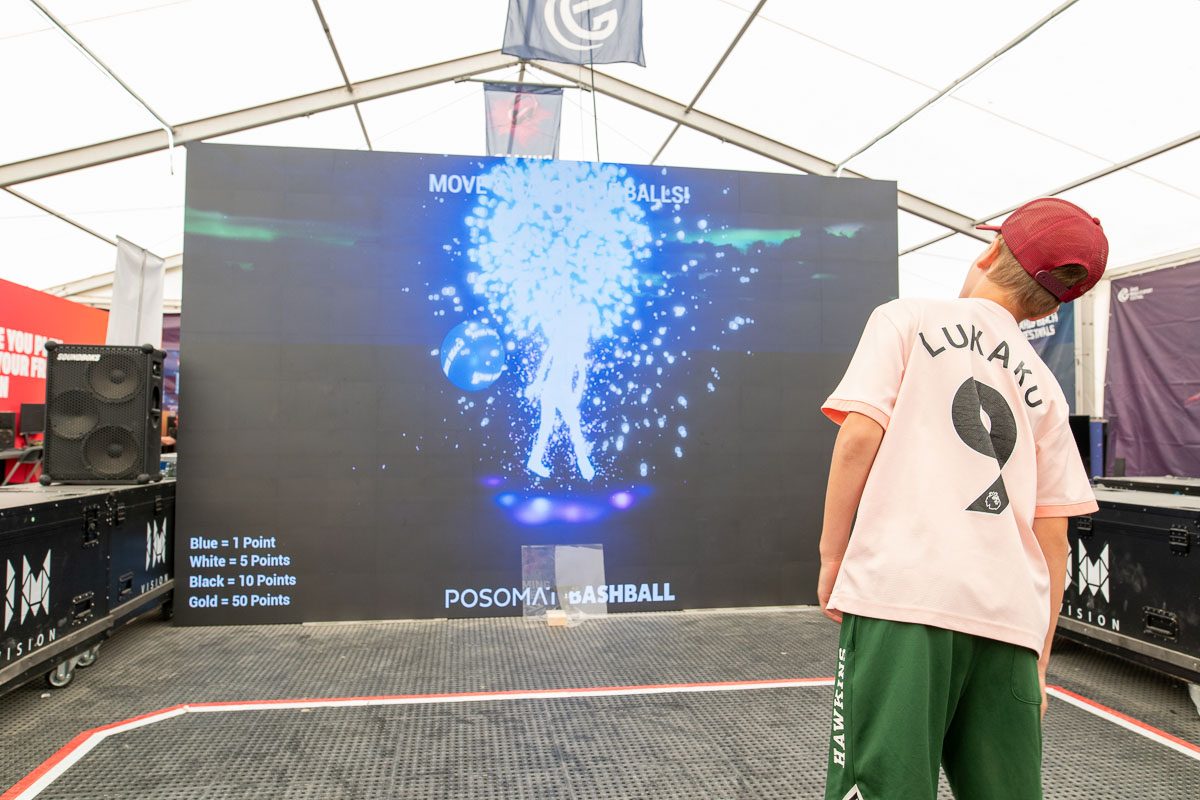 Users having fun playing the game on a 5-meter LED wall